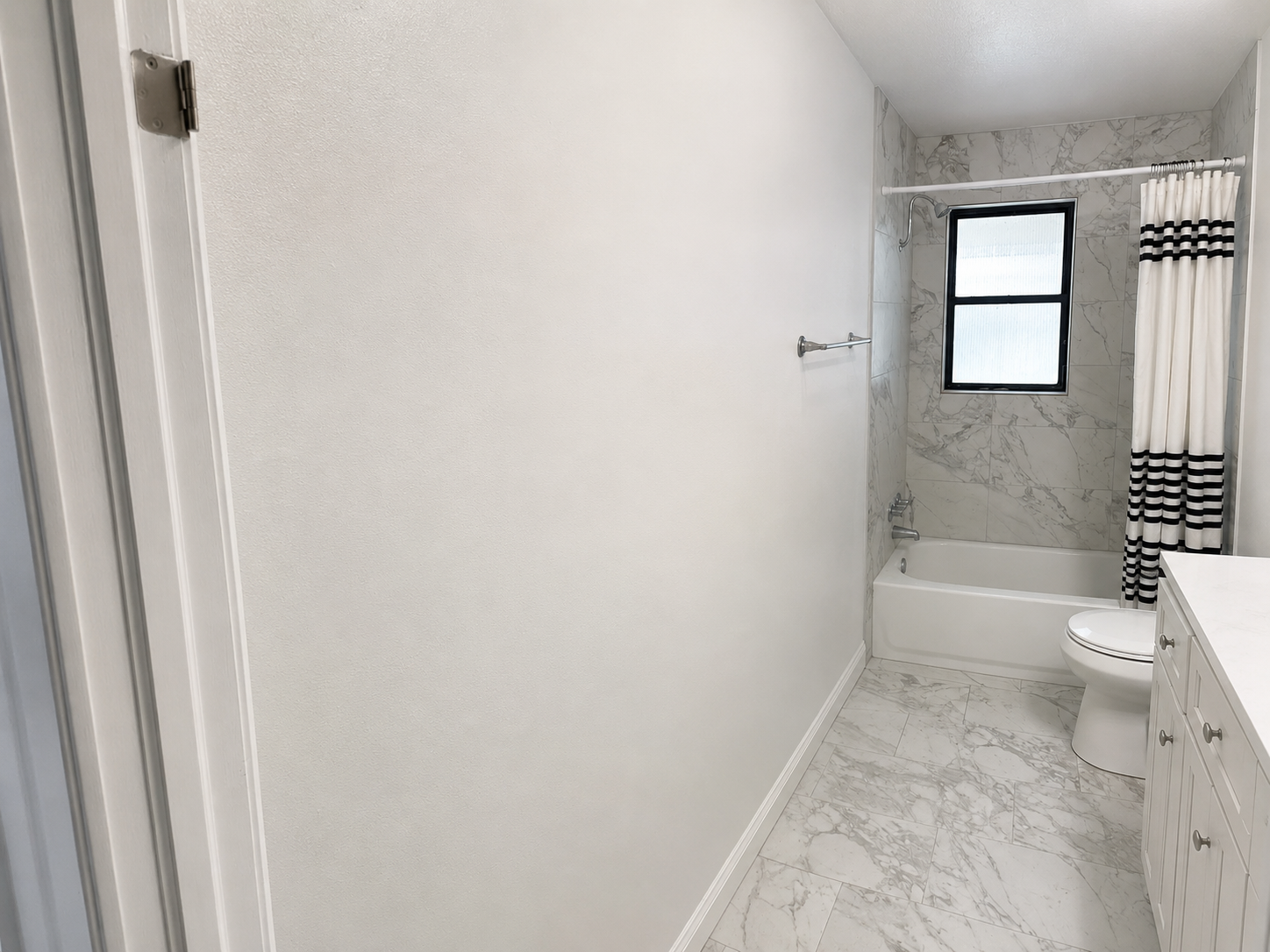 Finished drywall repair painted in bathroom